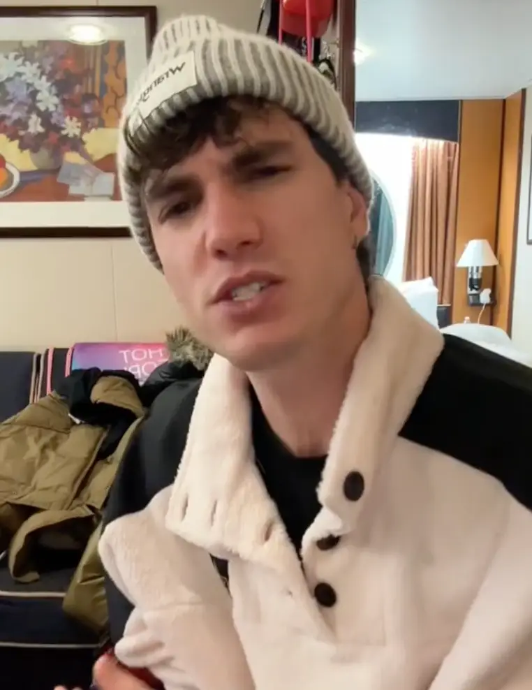 The influencer joked he's going to 'press charges' against Royal Caribbean.