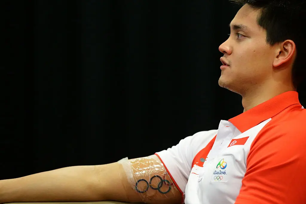 Singaporean Swimmer Joseph Schooling showing off his new Olympic ink. (Suhaimi Abdullah/Getty Images)