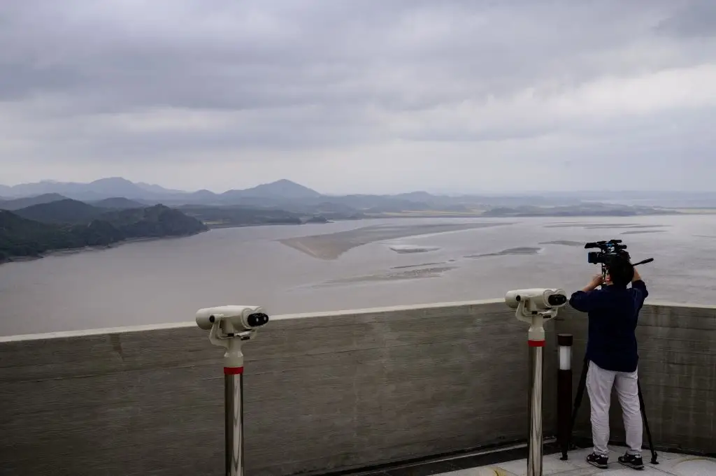 Starbucks customers can enjoy their lattes while looking over at Gaepung county at Aeigibong Peace Ecopark in Gimpo, Gyeonggi Province (ANTHONY WALLACE/AFP via Getty Images)