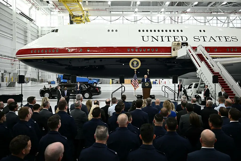 Donald Trump speaks in front of the new Air Force One, gifted to him by Qatar, in a hangar at Joint Base Andrews in Maryland (Brendan Smialowski / Getty Images))