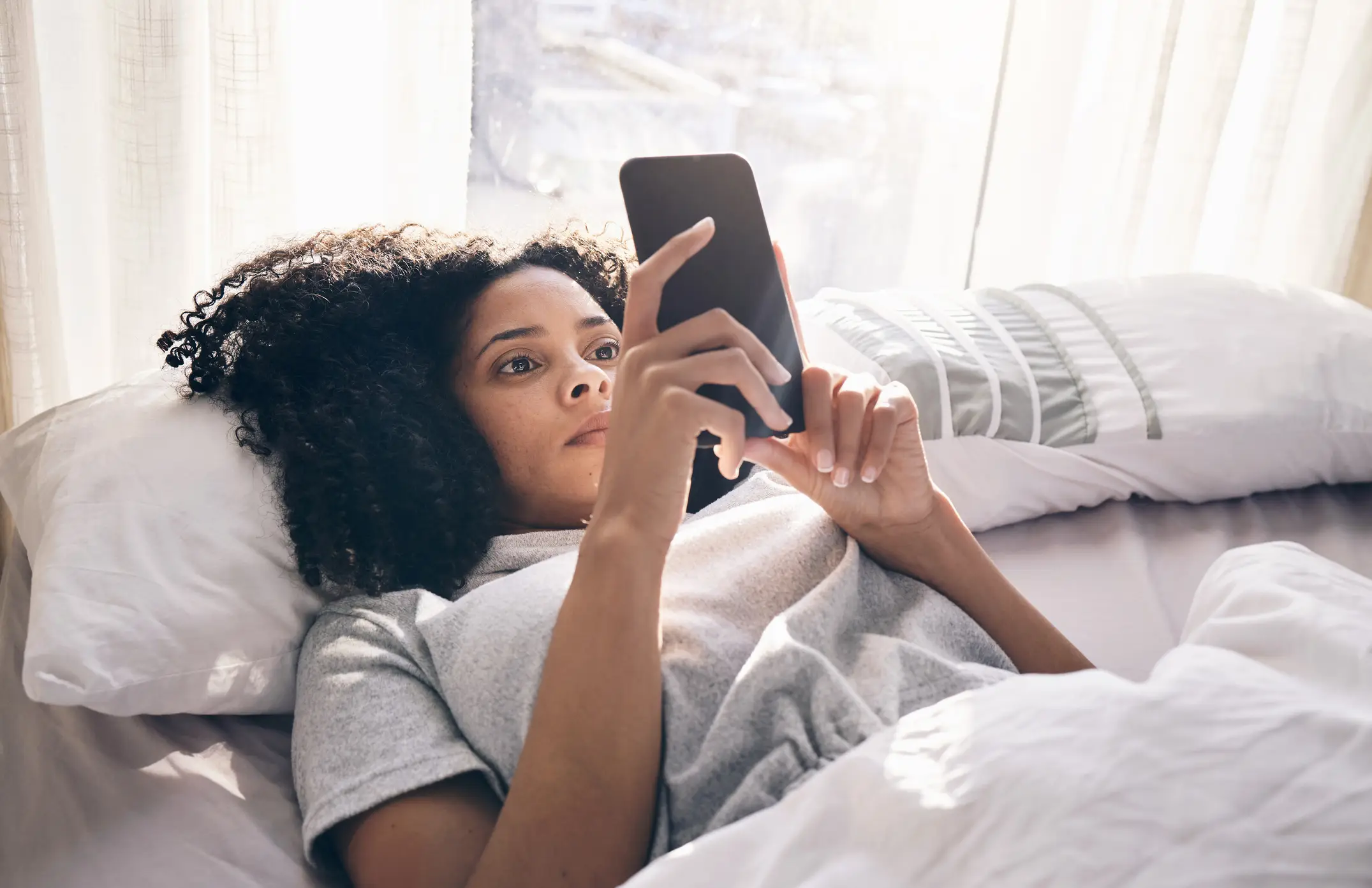 Limiting your screen time is key to a better mood and a more regular sleep routine (Getty Stock Images)