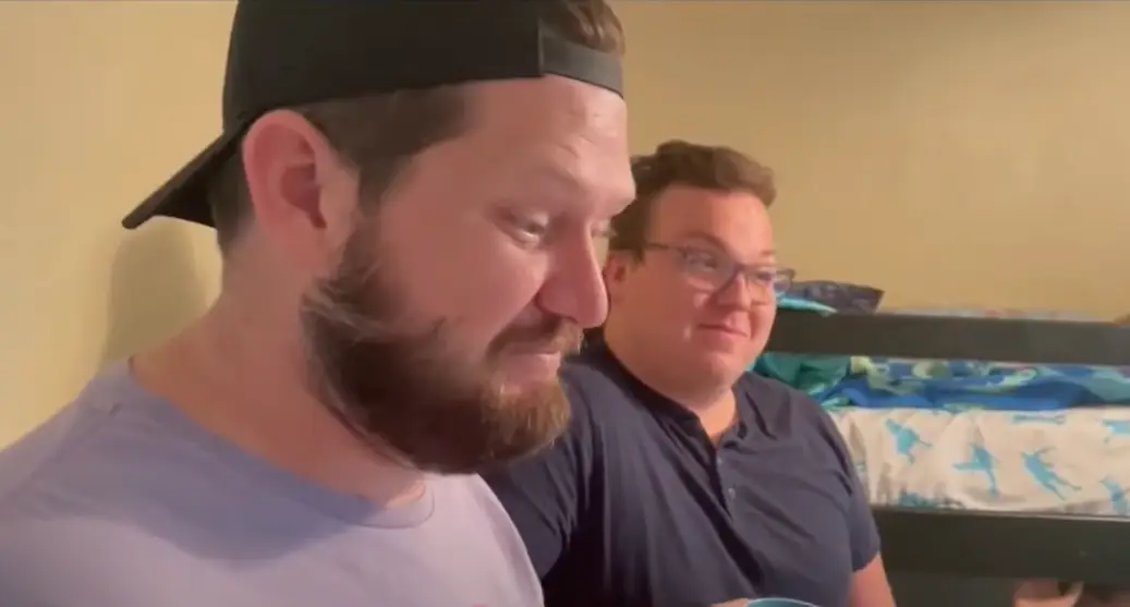 Dustin (right) and Daniel Johnson adopted six siblings.