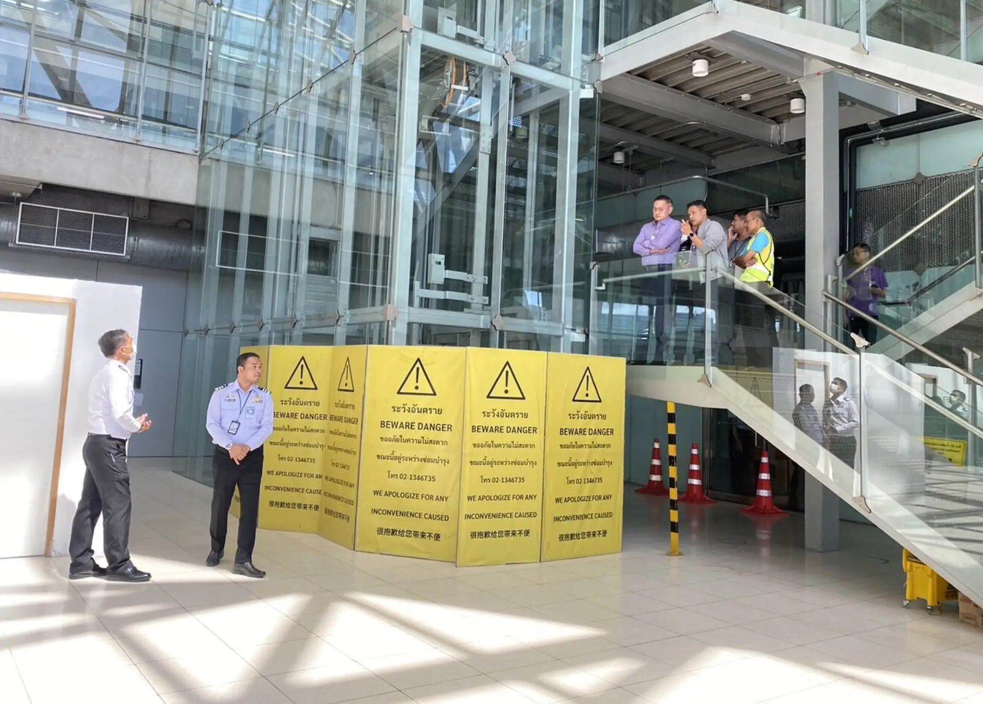 The airport worker was crushed by a glass elevator. (Asia Pacific Press via ViralPress)