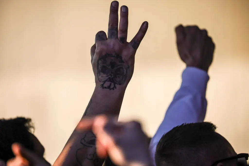 The White Power hand signal has long been associated with the far right (Photo by Omer Messinger/Getty Images)