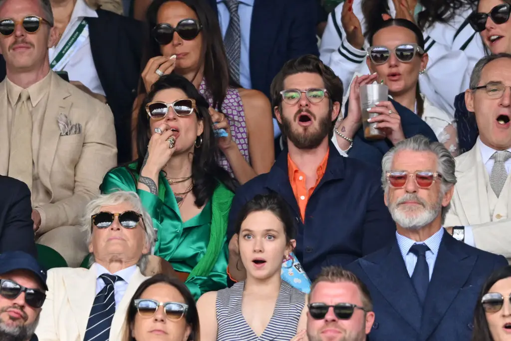 Tomas and Garfield papped in the crowd at Wimbledon, alongside Pierce Brosnan. (Karwai Tang/WireImage)