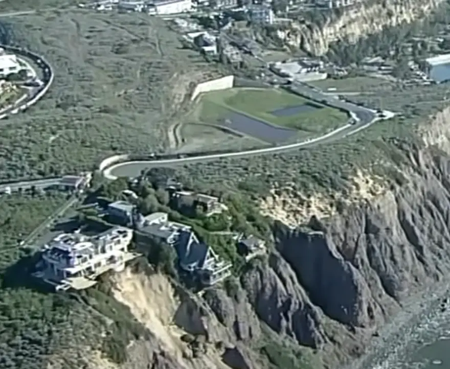 The three homes have been evaluated as structurally sound despite their position on the cliff's edge.