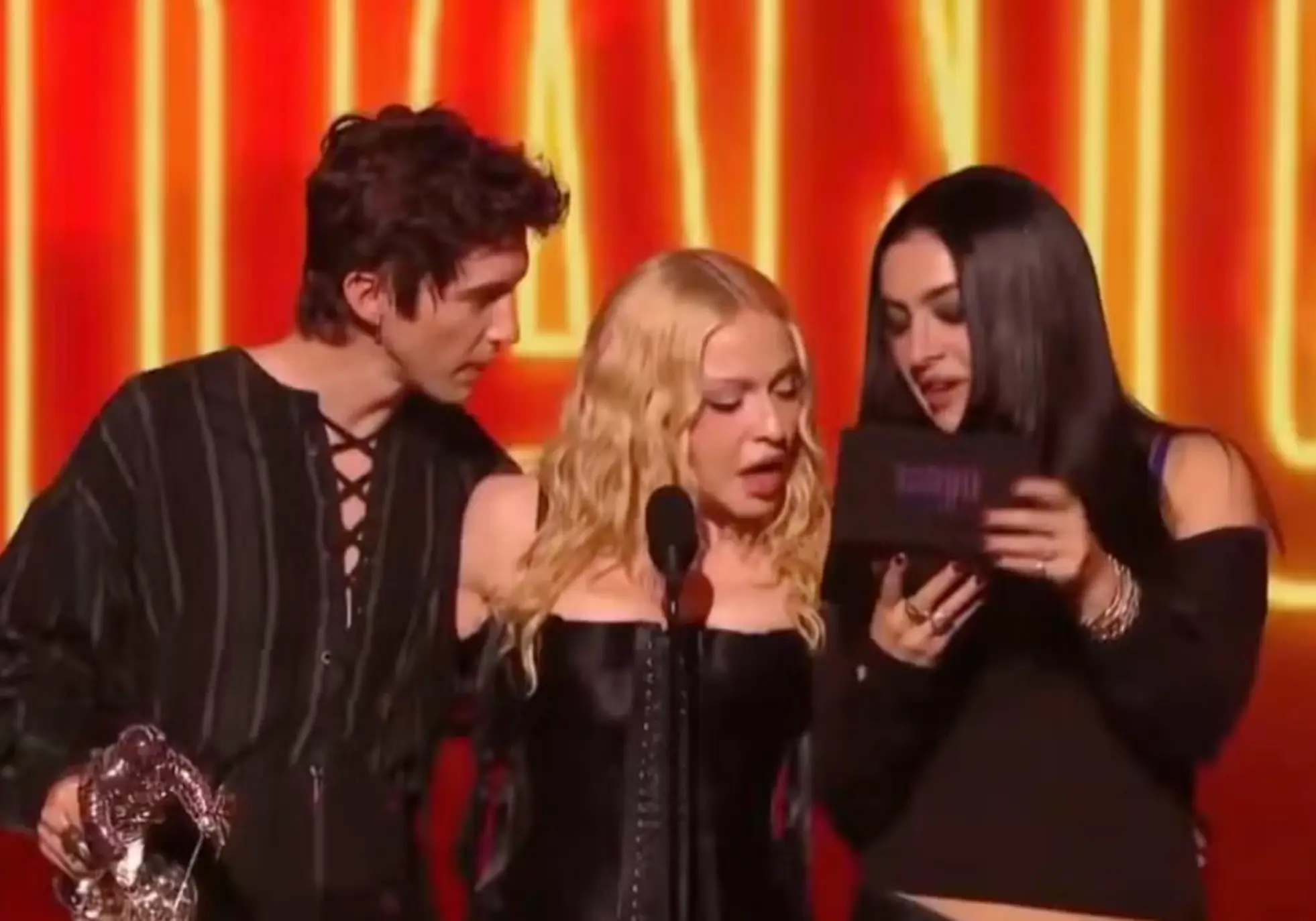 During her acceptance speech for the Best Dance award, Madonna called over Troye Sivan and Charli XCX (CBS)