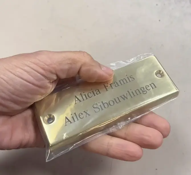 Alicia had a brass plaque made with both of their names engraved.