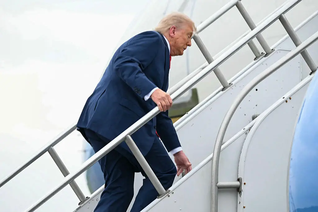 Trump stumbled up the stairs to Air Force One yesterday (ANDREW CABALLERO-REYNOLDS/AFP via Getty Images)