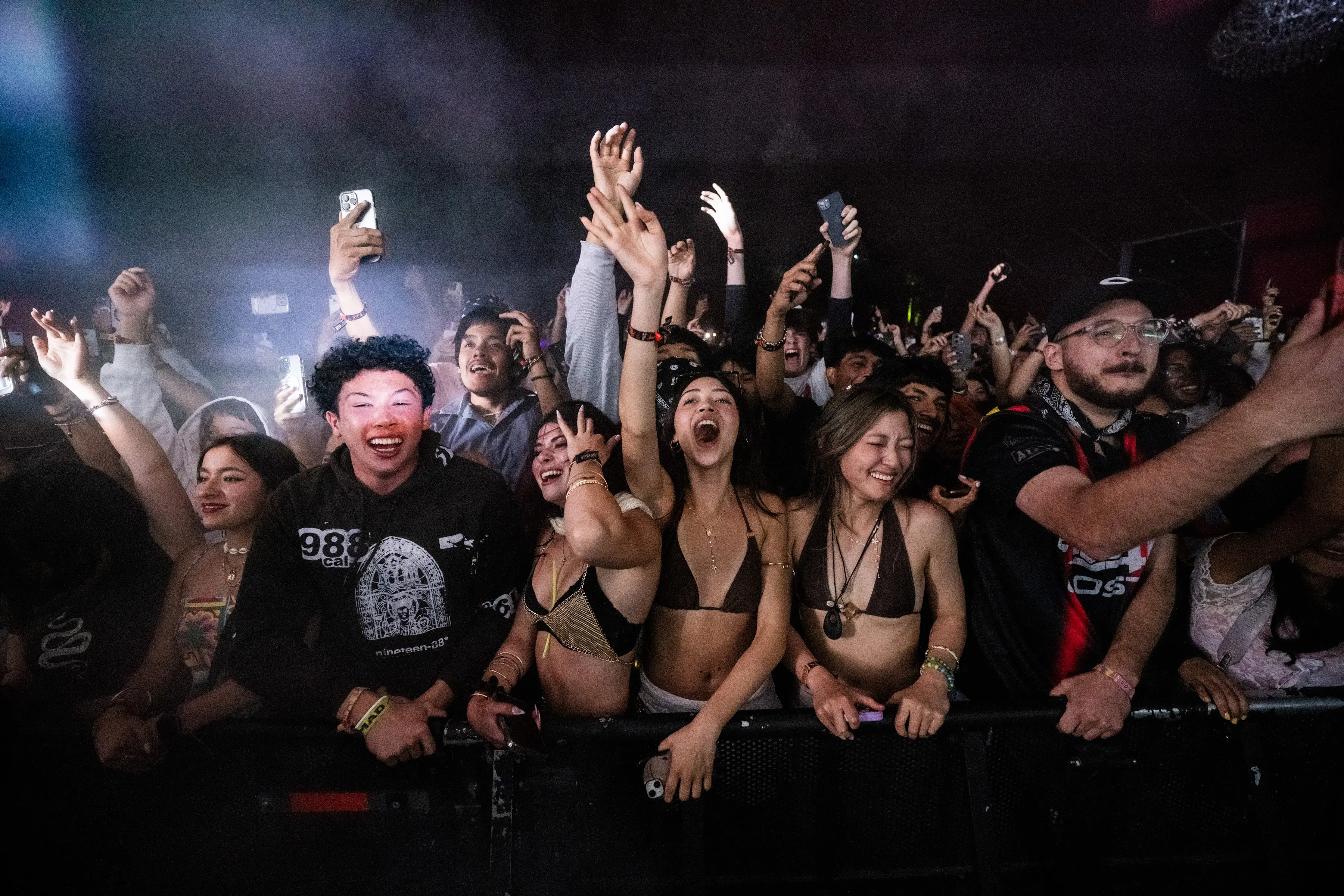 Crowd cheering at Coachella (Photo by Timothy Norris/Getty Images for Coachella))
