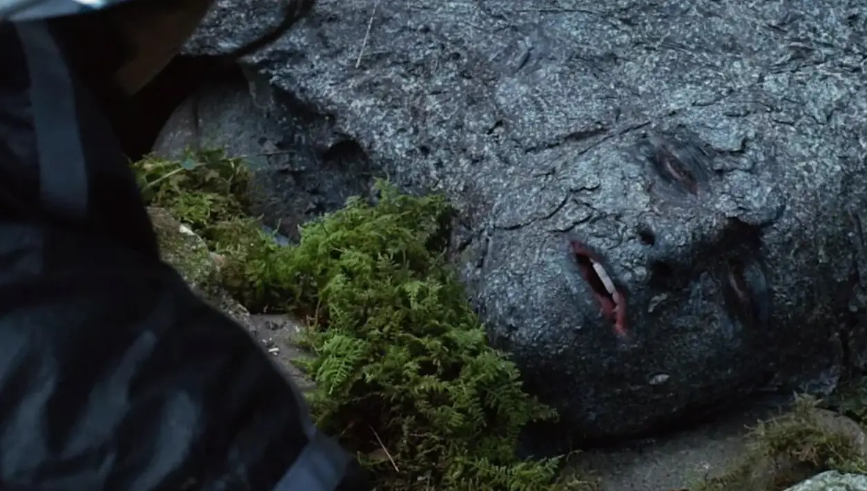 Peeta transforms himself into a rock (Lionsgate)