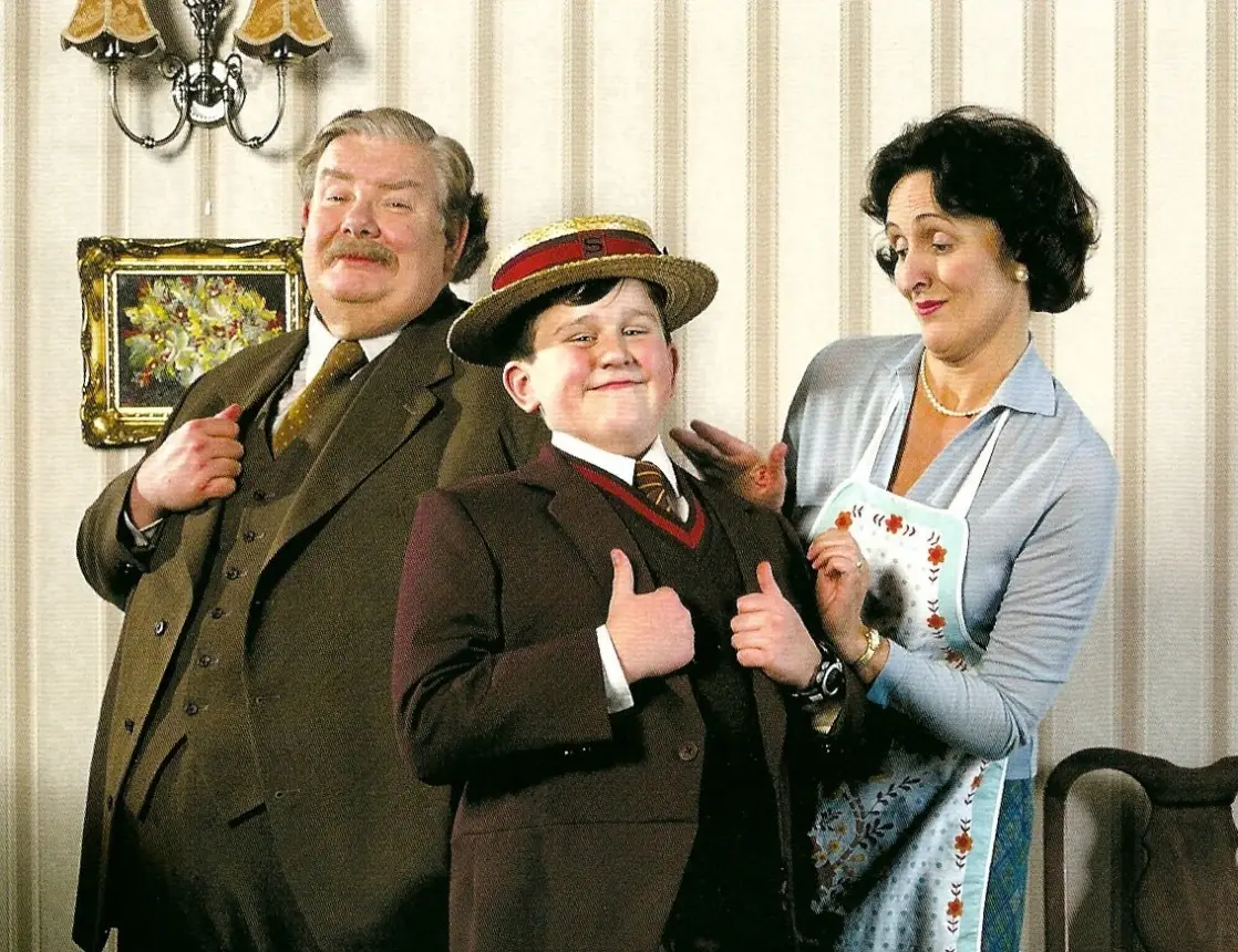 Harry played the villainous Dudley, seen here with dad Vernon and mum Petunia (Warner Bros)