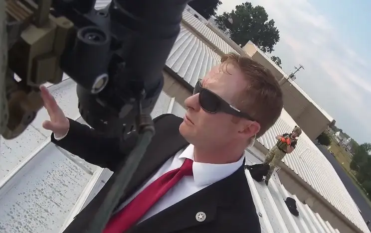 A man in a red tie can be seen assessing the situation. (Beaver County Emergency Services Unit) 