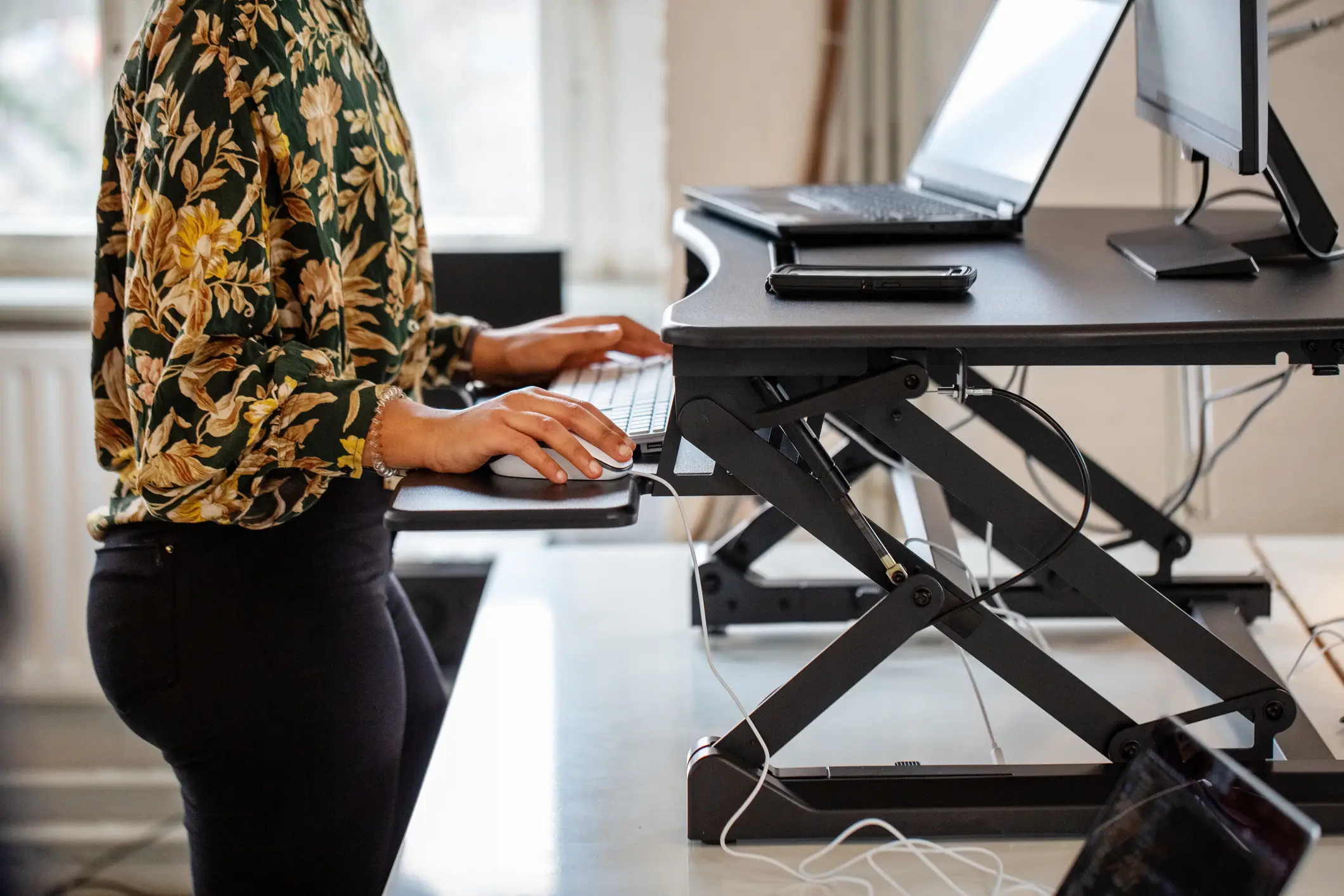A standing desk could be a way to help sit down less (Luis Alvarez / Getty)