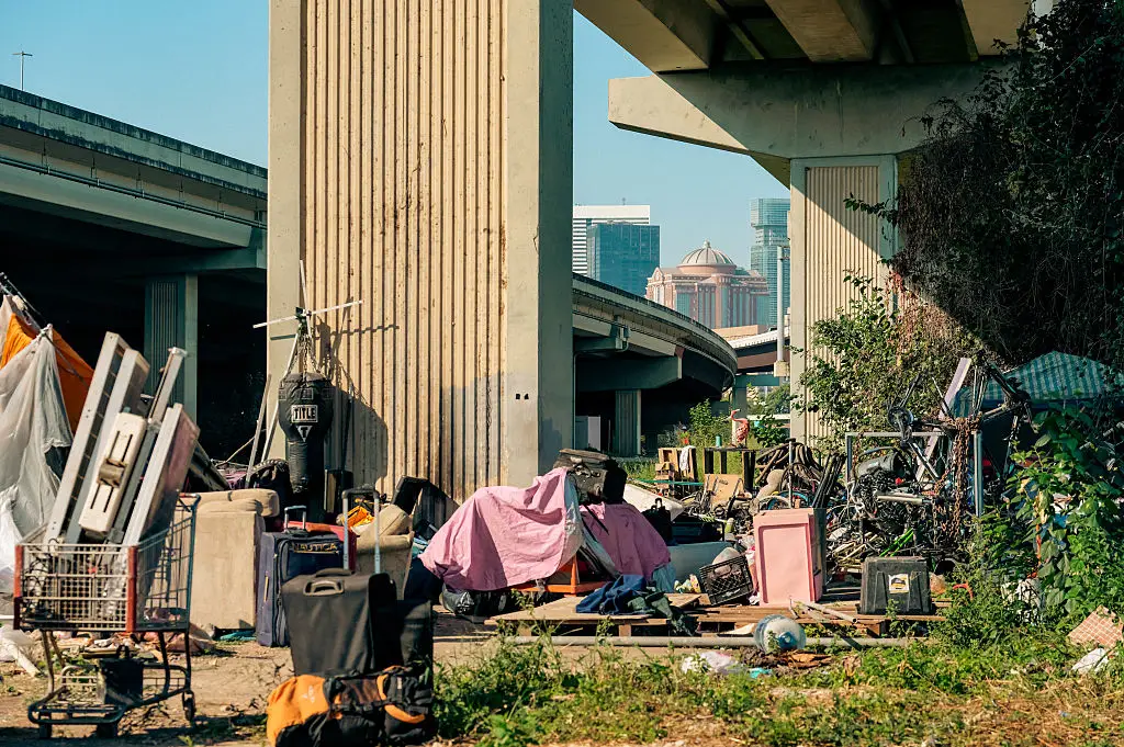 City of Houston workers, accompanied by police officers, cleared a homeless encampment along the Buffalo Bayou back in October (Raquel Natalicchio/Houston Chronicle via Getty Images)
