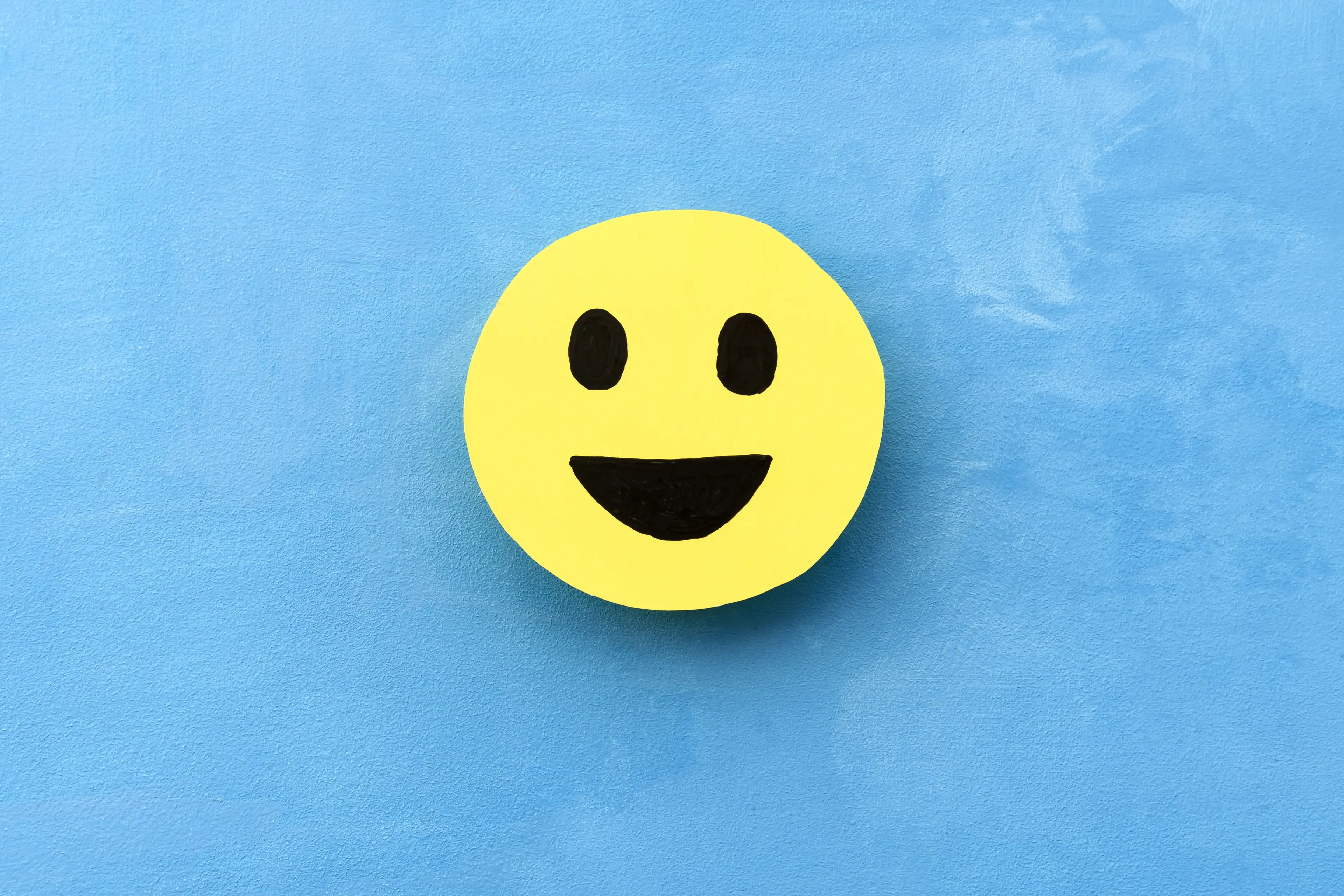 According to the study, a simple smiley faces does the trick.