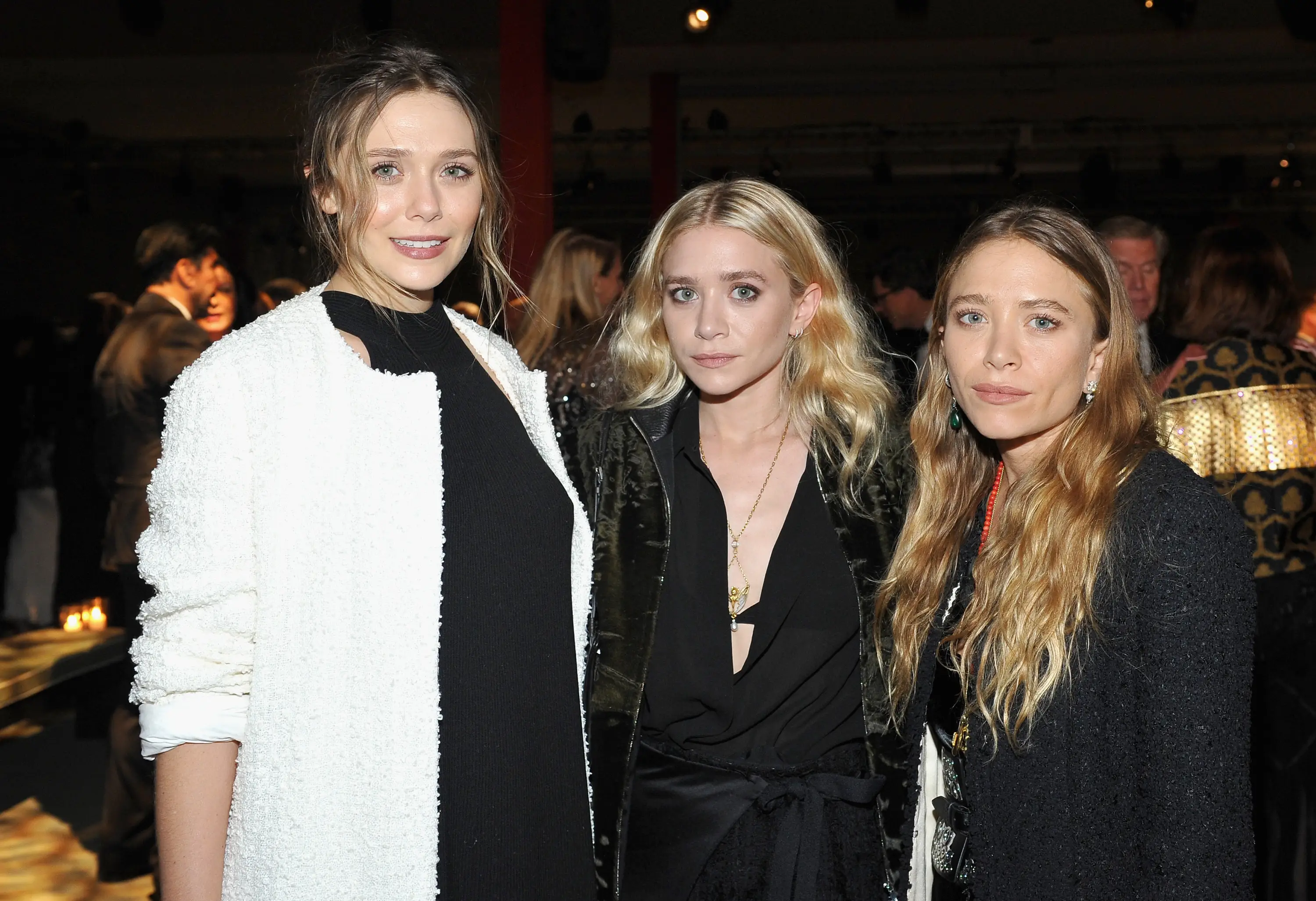 Elizabeth OIsen pictured with her older sisters, Mary-Kate and Ashley (Donato Sardella/Getty Images for LACMA)