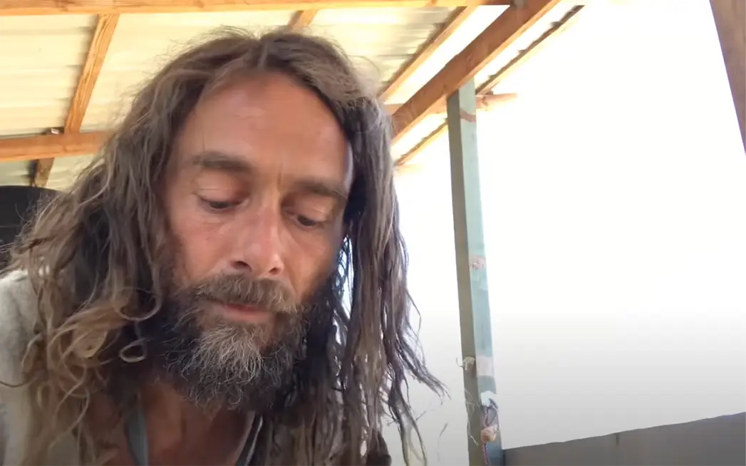 Aaron Fletcher left home 15 years ago and lives in his own wagon with some sheep.