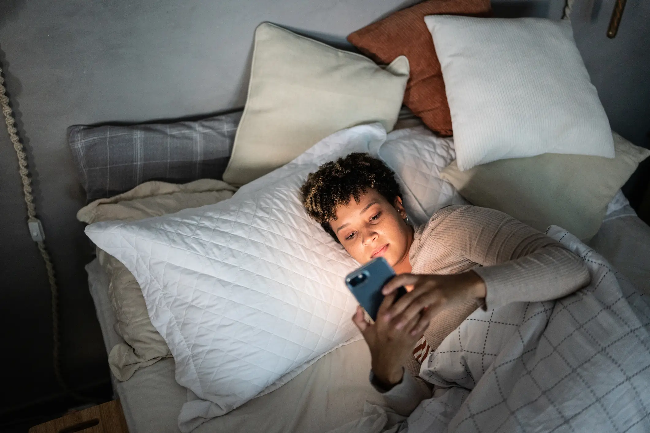 Going on your phone in bed can have devastating affect on your sleep (Getty Stock Image) 