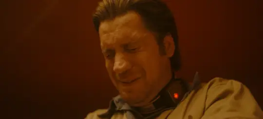 Brad/X-5 grimaced as his friends were murdered.