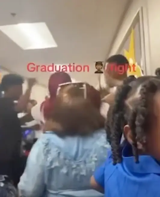 Parents began brawling during the elementary graduation day (YouTube/ WREG News Channel 3/ Aleicia Evans)