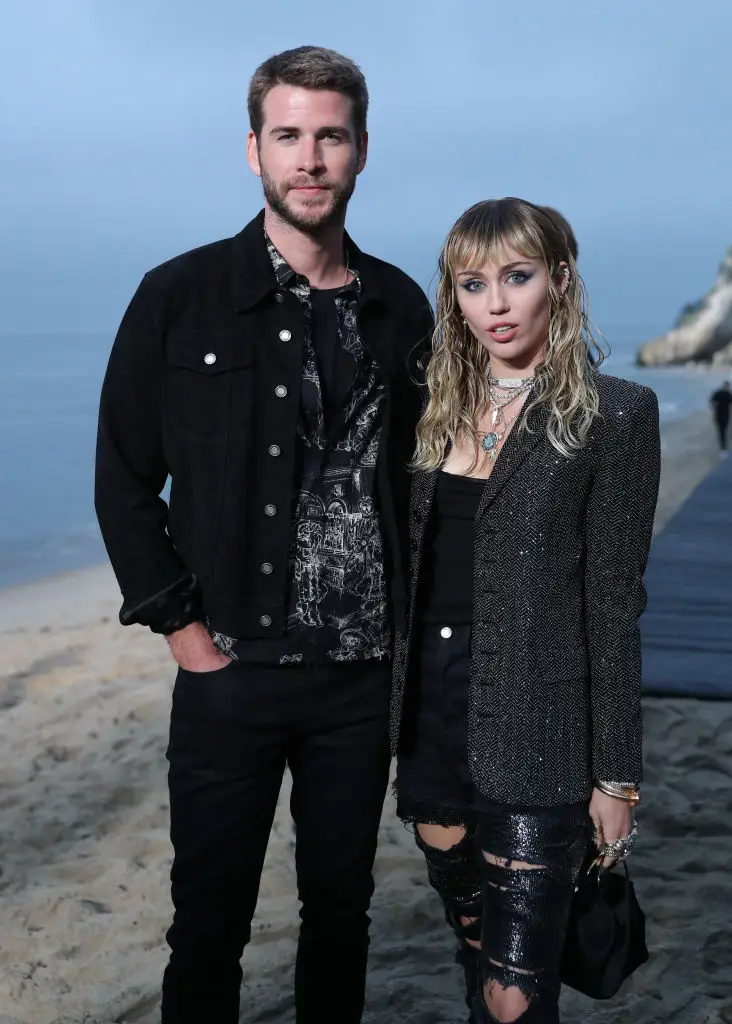 Hemsworth and Cyrus pictured while married in June 2019 - two months before announcing their split (Chelsea Lauren/WWD/Penske Media via Getty Images)