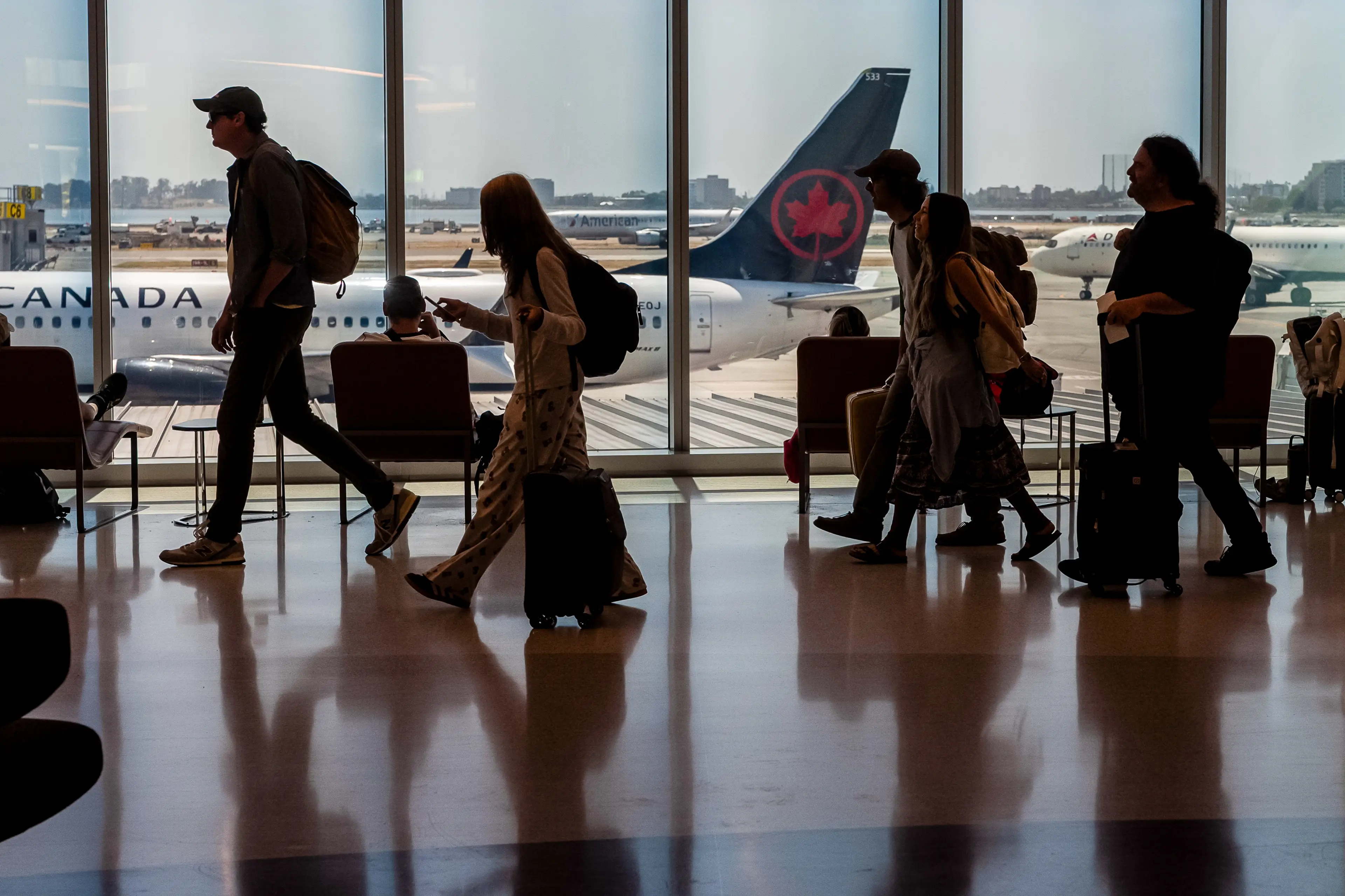 Passengers at at San Francisco International Airport (SFO) earlier this week (David Paul Morris/Bloomberg via Getty Images)