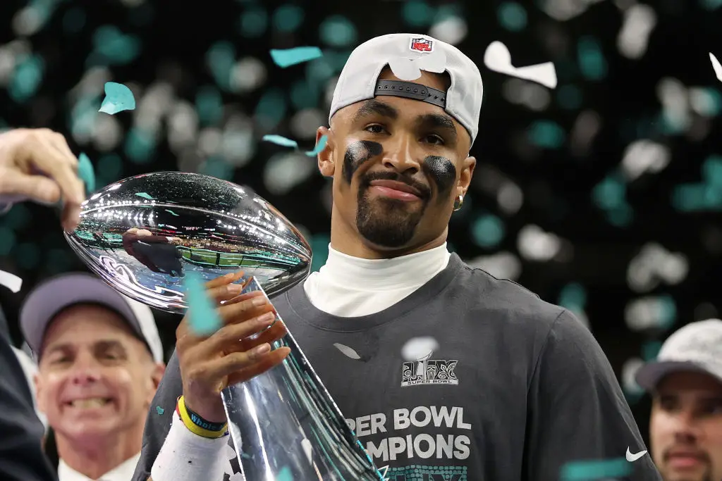 MVP Jalen Hurts, of the Philadelphia Eagles, celebrated with the Vince Lombardi Trophy (Jamie Squire/Getty Images)