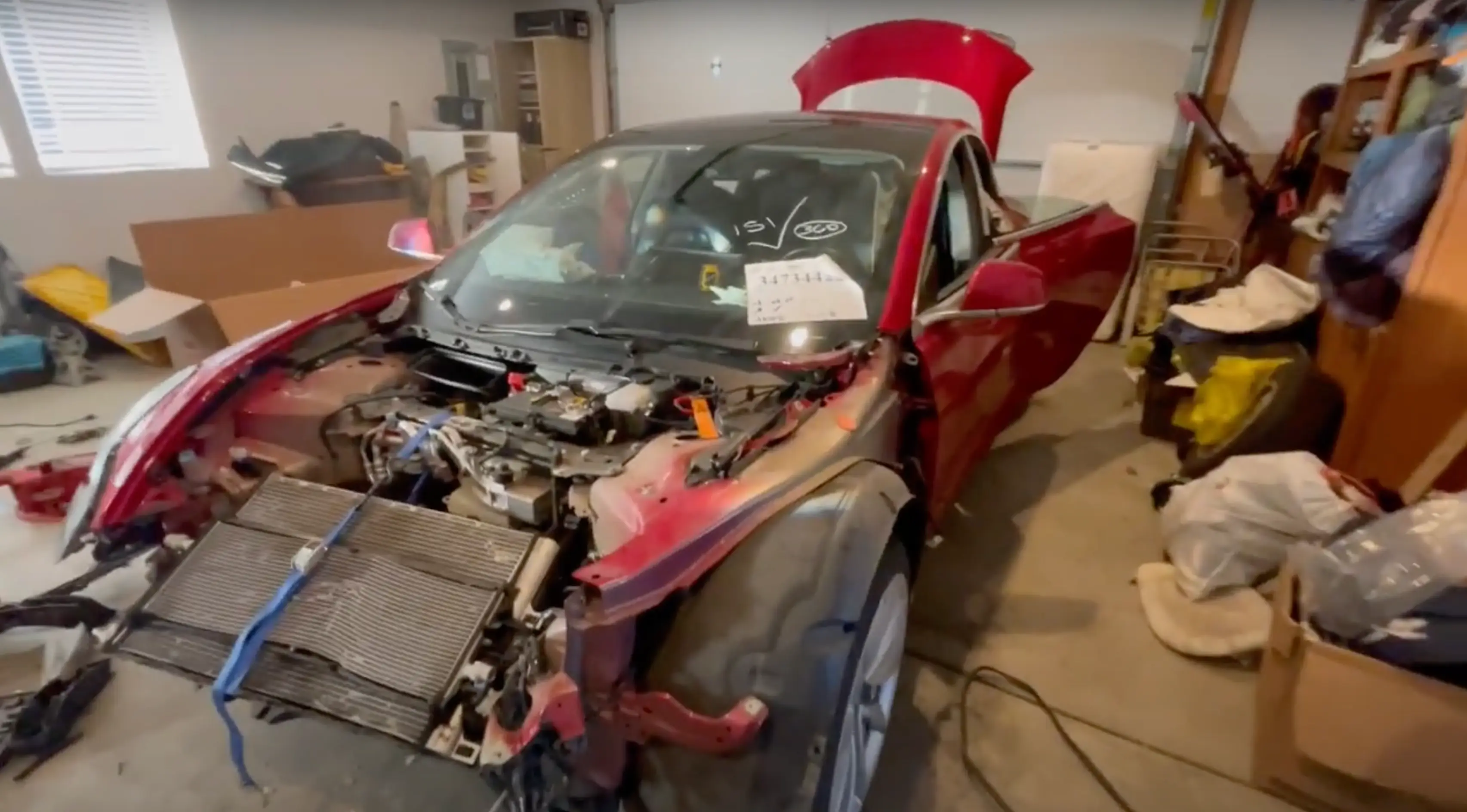 The 2018 Tesla Model 3 was restored to its former glory by an 18-year-old (YouTube/WinstonsGarage)
