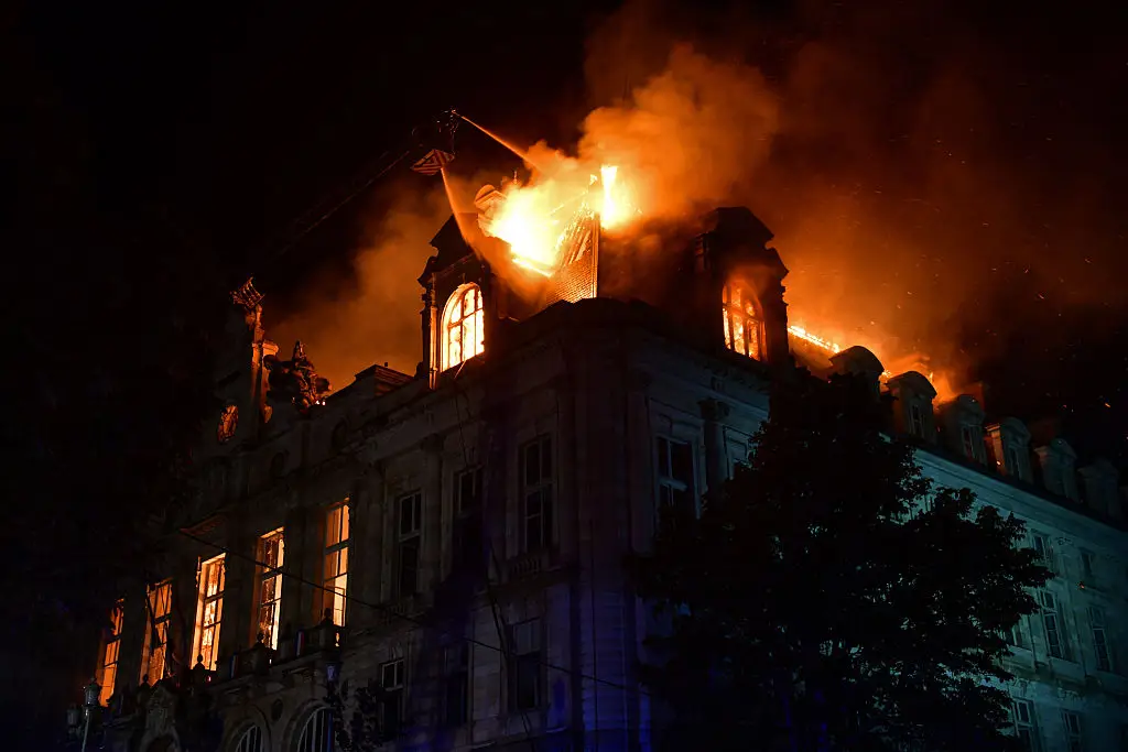 Over 200 miles outside of Paris, a city hall in Limoges was set on fire (PASCAL LACHENAUD / AFP via Getty Images)