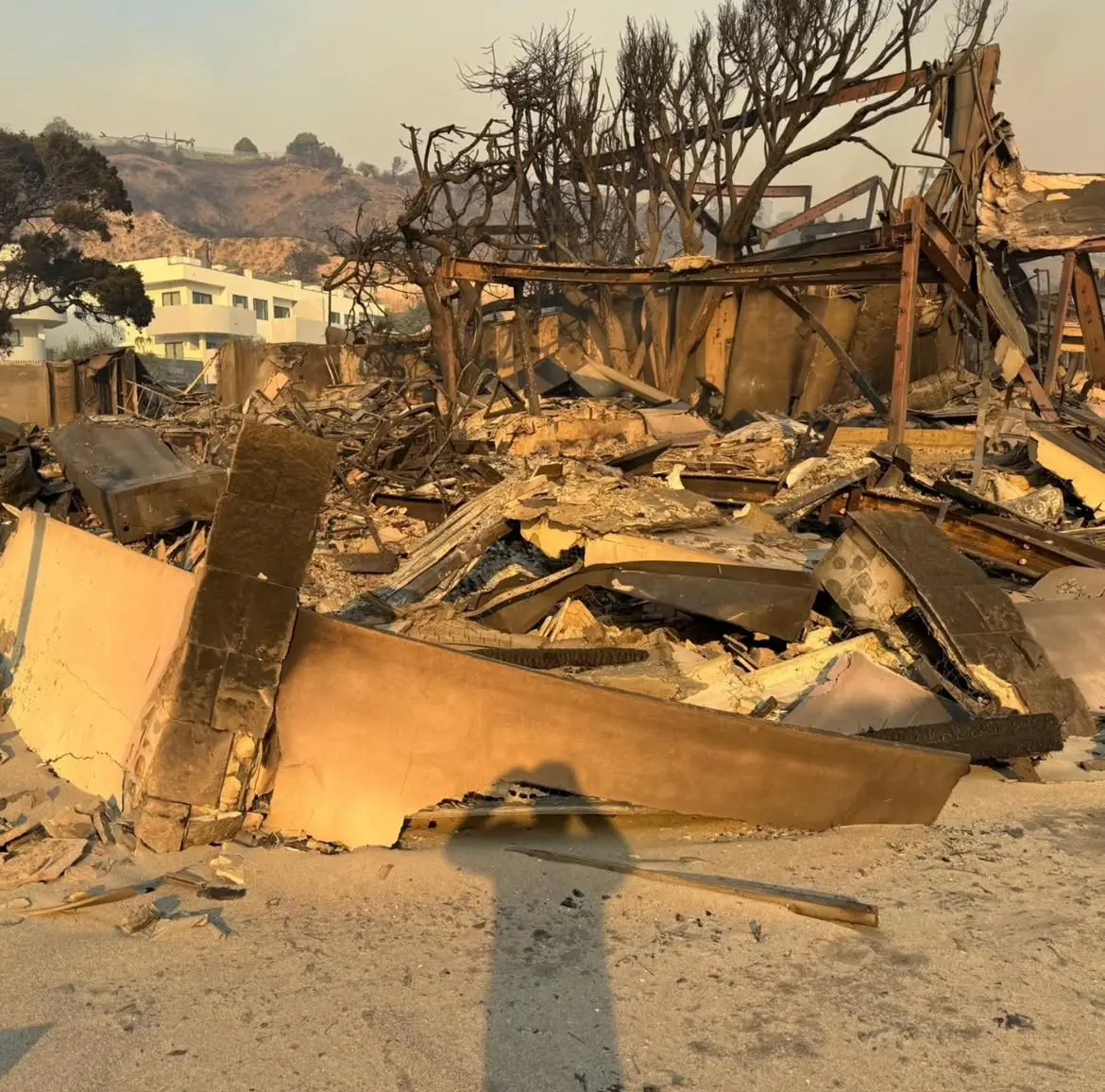 The 34-year-old's property was reduced to ash and rubble following the first day of the blaze (robert_rivani/Instagram)
