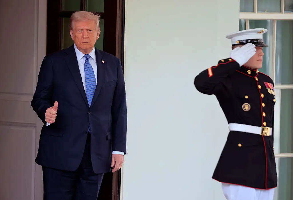 Trump has insisted that the US economy will 'boom' under his control as he urged Americans to be patient (Chip Somodevilla/Getty Images)