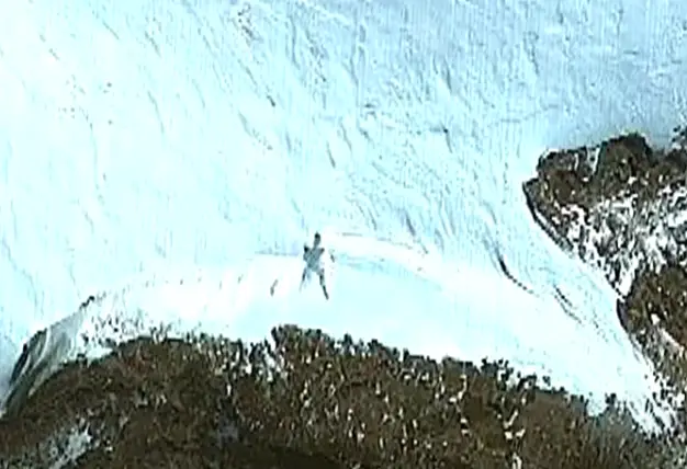 The body appears to be lying in the snow. (Google Earth)