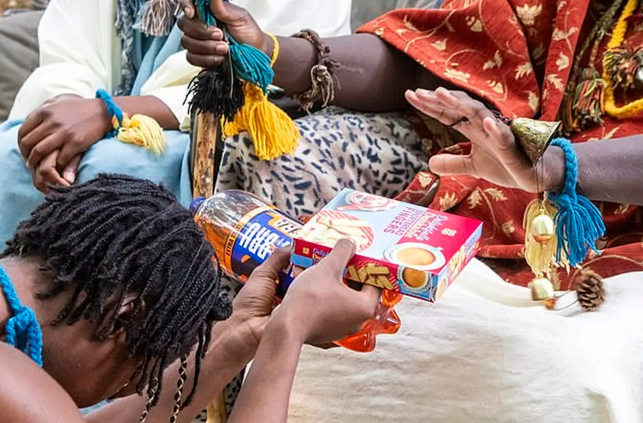She has been seen offering food to the 'King' and 'Queen' (SWNS)