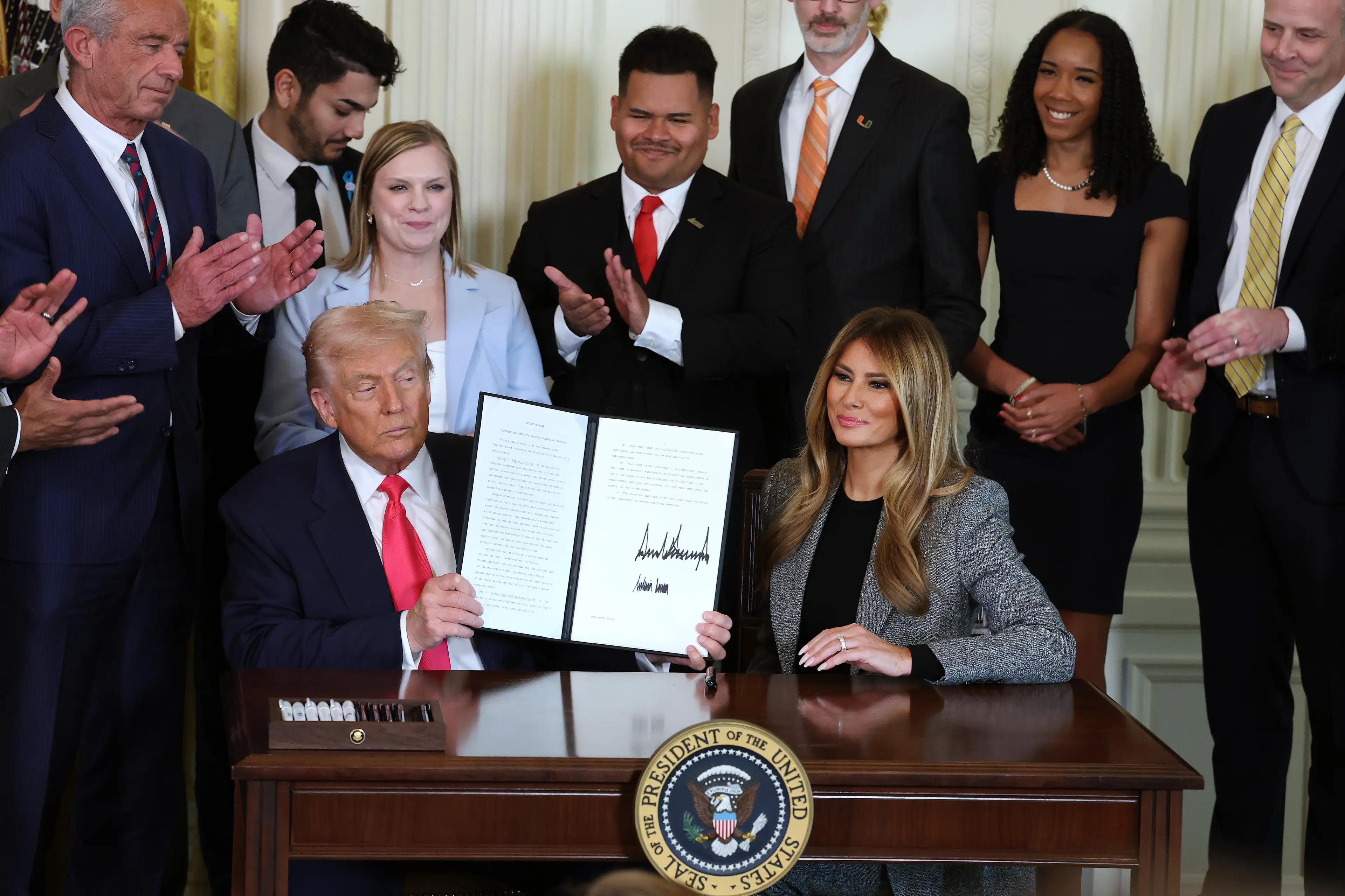 Melania signed the executive order alongside her husband (Anna Moneymaker/Getty Images)