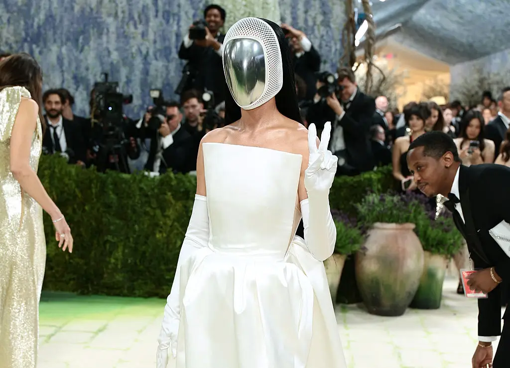 Perry's mask is 'designed to be a literal and symbolic reflection that invites the observer to consider that their perception of others can mirror their own internal world, and conversely mask truth' (Dimitrios Kambouris/Getty Images for The Met Museum/Vogue)