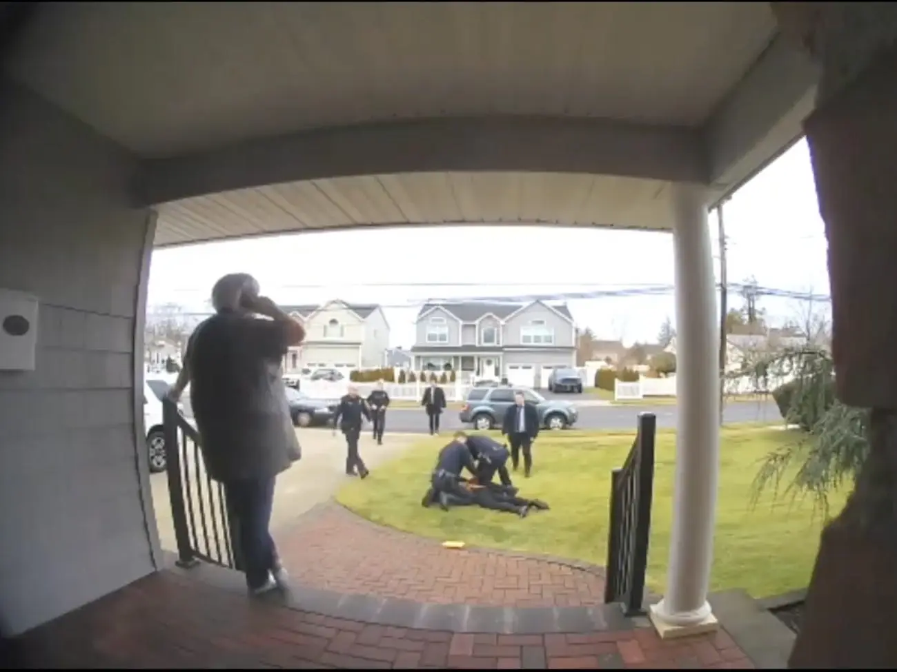 Jean watches while the scammers get arrested (Nassau County Police Department)