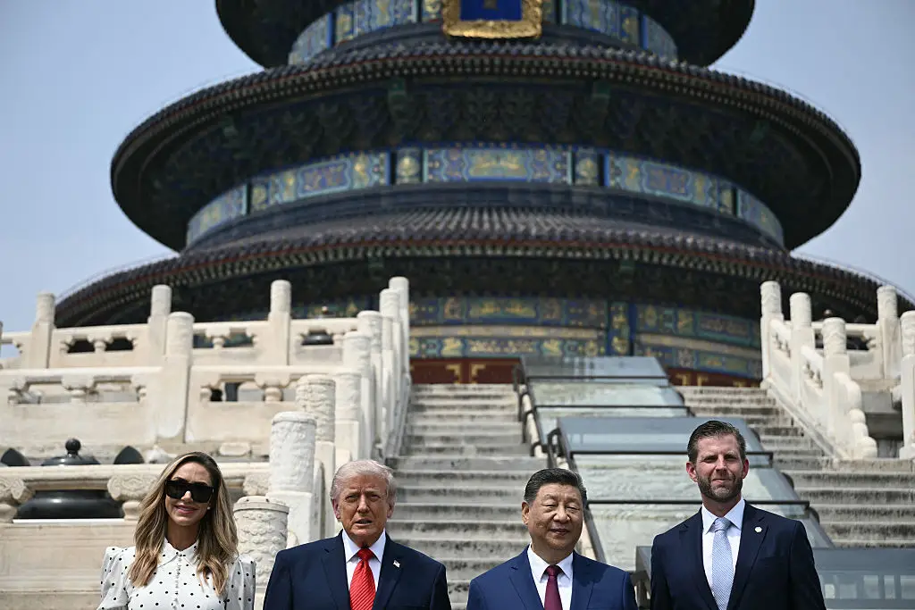 Eric was a key part of the delegation, with President Xi Jingping even posing for a picture with him and wife Lara (Brendan SMIALOWSKI / POOL / AFP via Getty Images)
