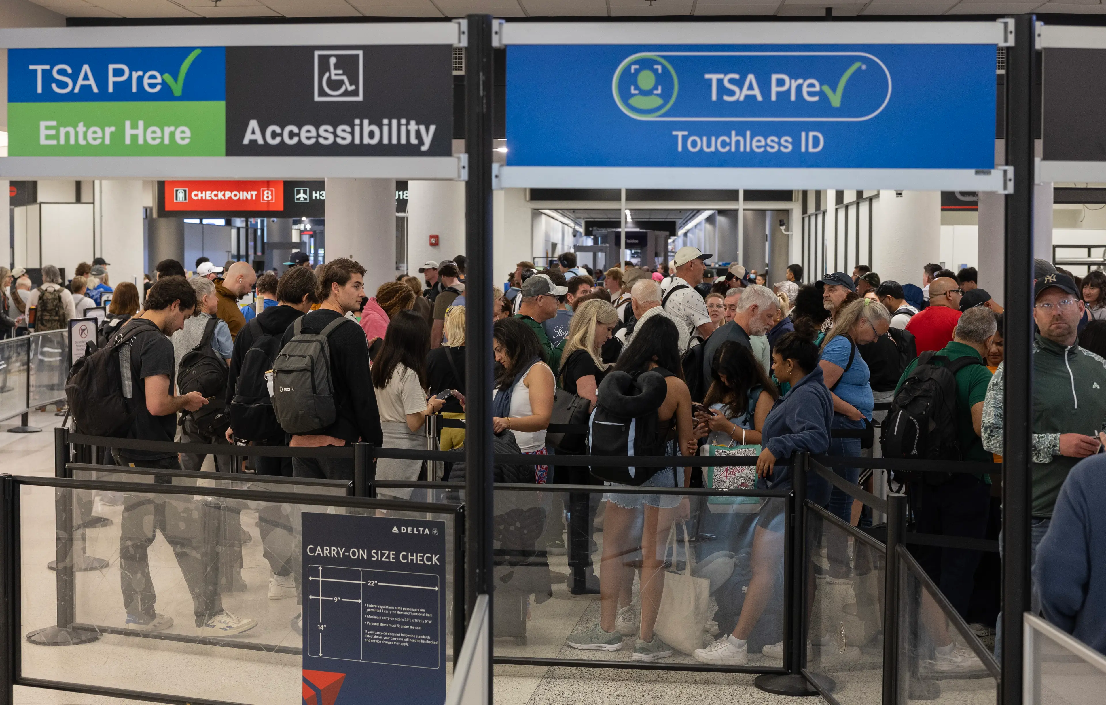 Long queues have become a common sight in US airports (Joe Raedle/Getty Images)