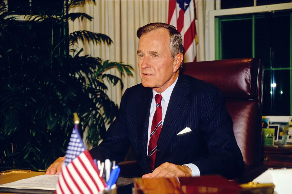 George H.W. Bush in the Oval Office in October 1990 (Howard L. Sachs/CNP/Getty Images)