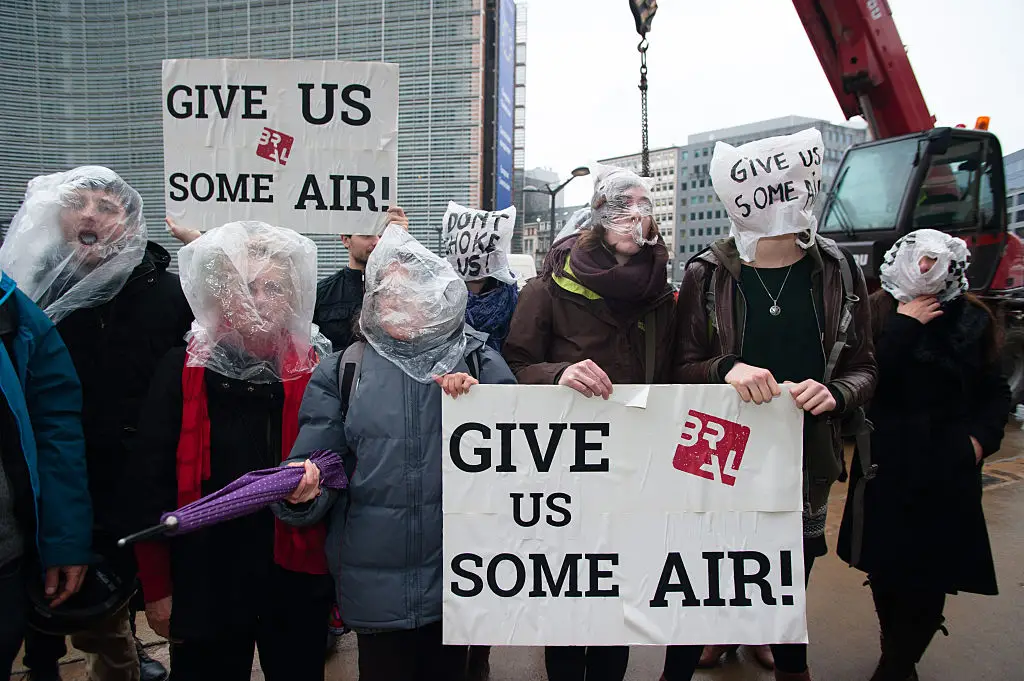 Activists protest for clean air and for a solution of the dieselgate affair by pretending to be choked with plastic bags over their heads at the European council in Brussels, back in 2015 Frederik Sadones/Pacific Press/LightRocket via Getty Images)