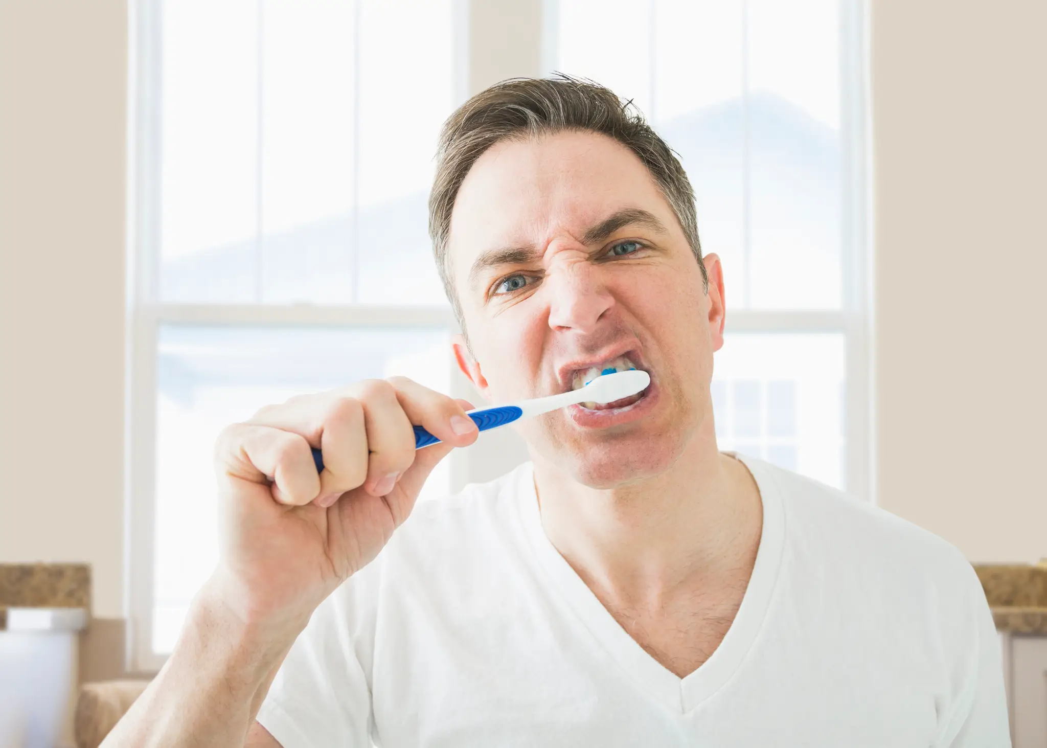 Applying too much pressure while brushing your teeth actually does more harm than good (Getty stock)