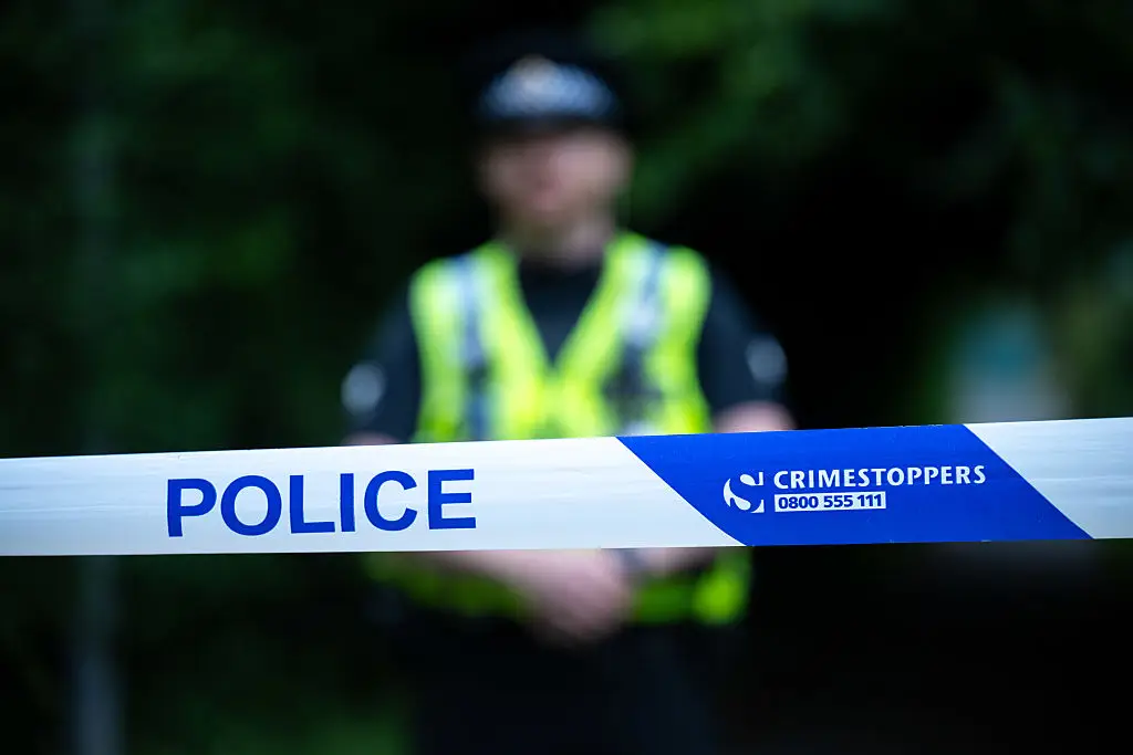 British police found the woman's body covered with a blanket on the sofa (Finnbarr Webster/Getty Images)