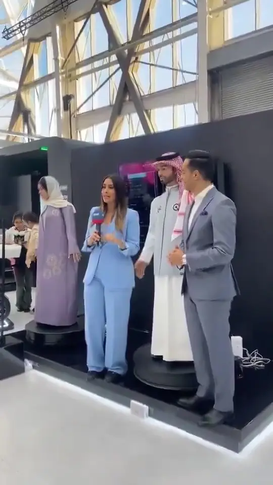 Muhammed appears to touch the reporter's backside.