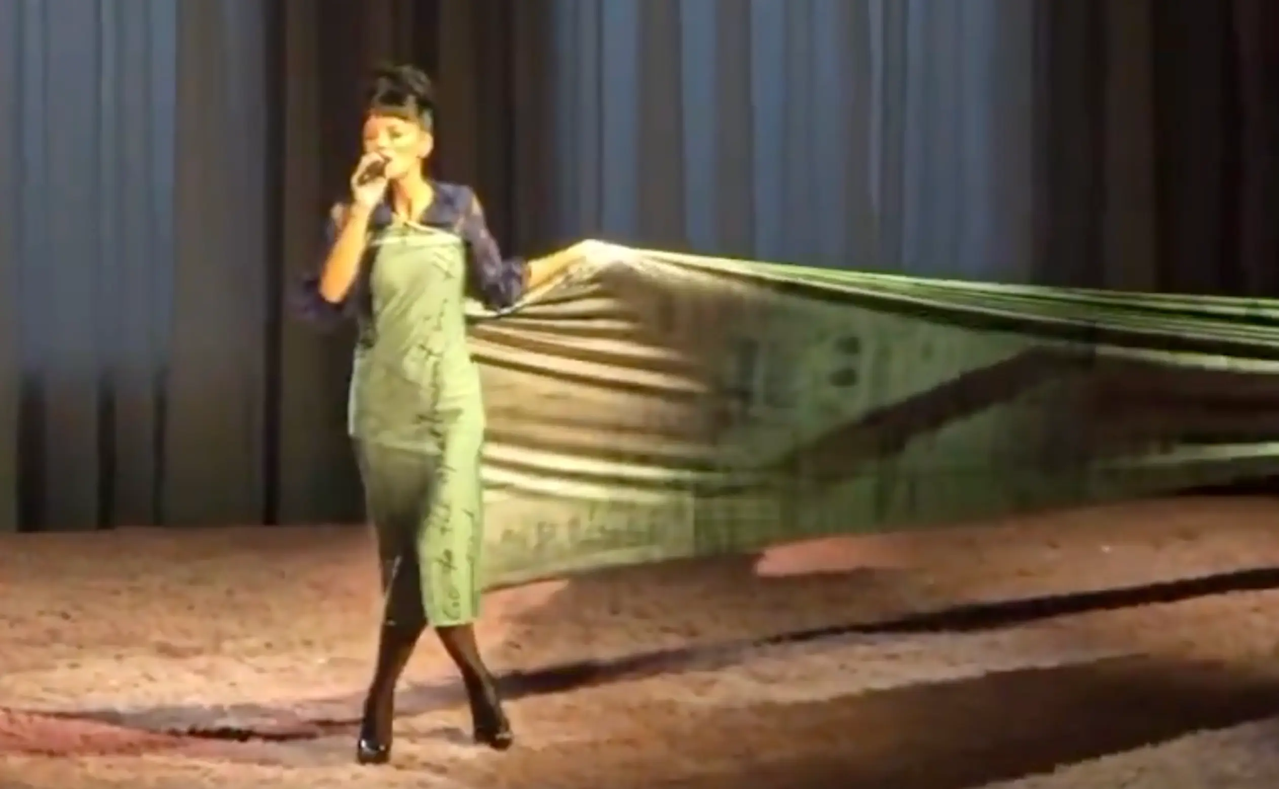The singer dons a dress that is seemingly printed with receipts during one part of her show (X)