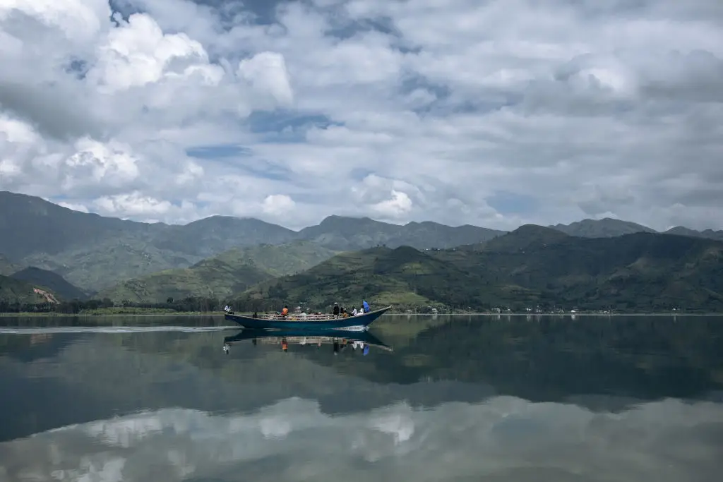 Passengers sail on a handmade wooden boat on Lake Kivu from Minova to Goma, back in March (ALEXIS HUGUET/AFP via Getty Images)
