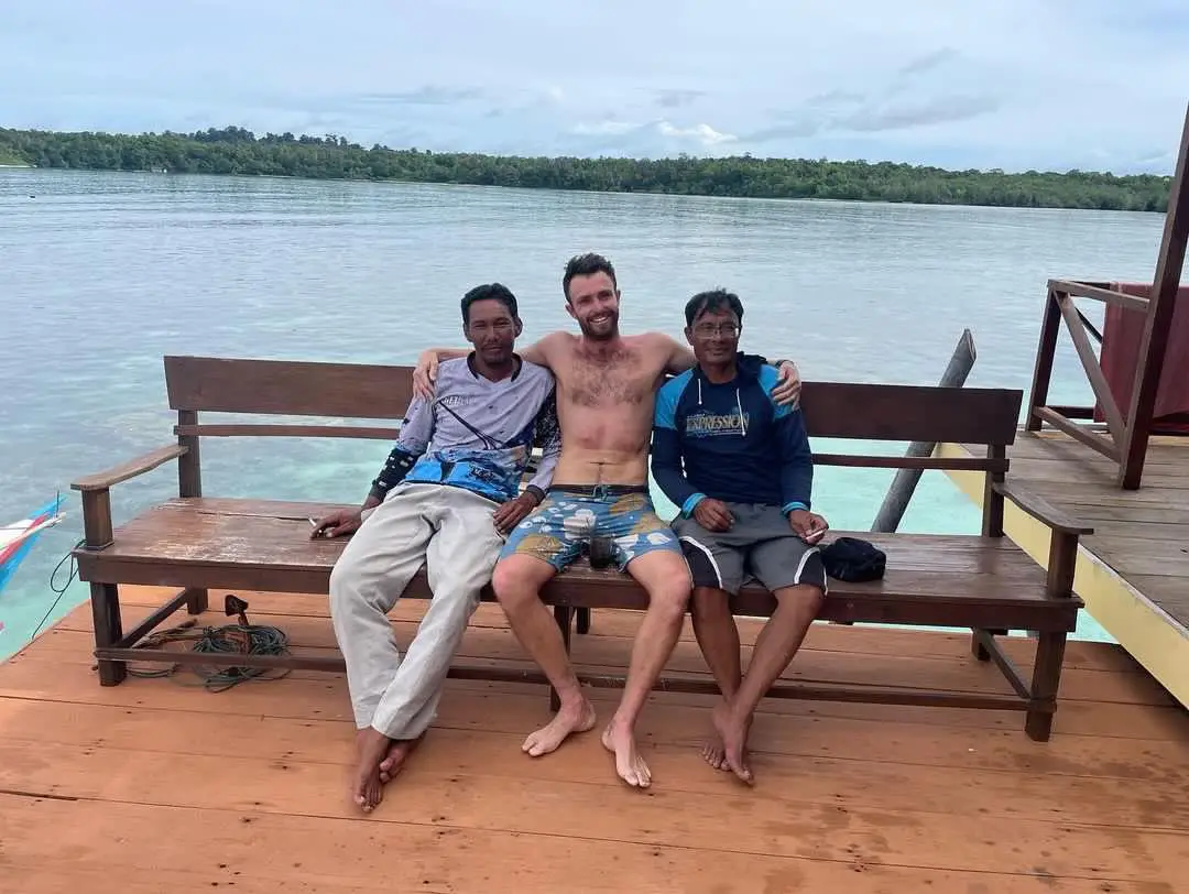 Elliot Foote pictured with the two fishermen who pulled him out of the water - ending his 37-hour nightmare (Courtesy of Elliot Foote)