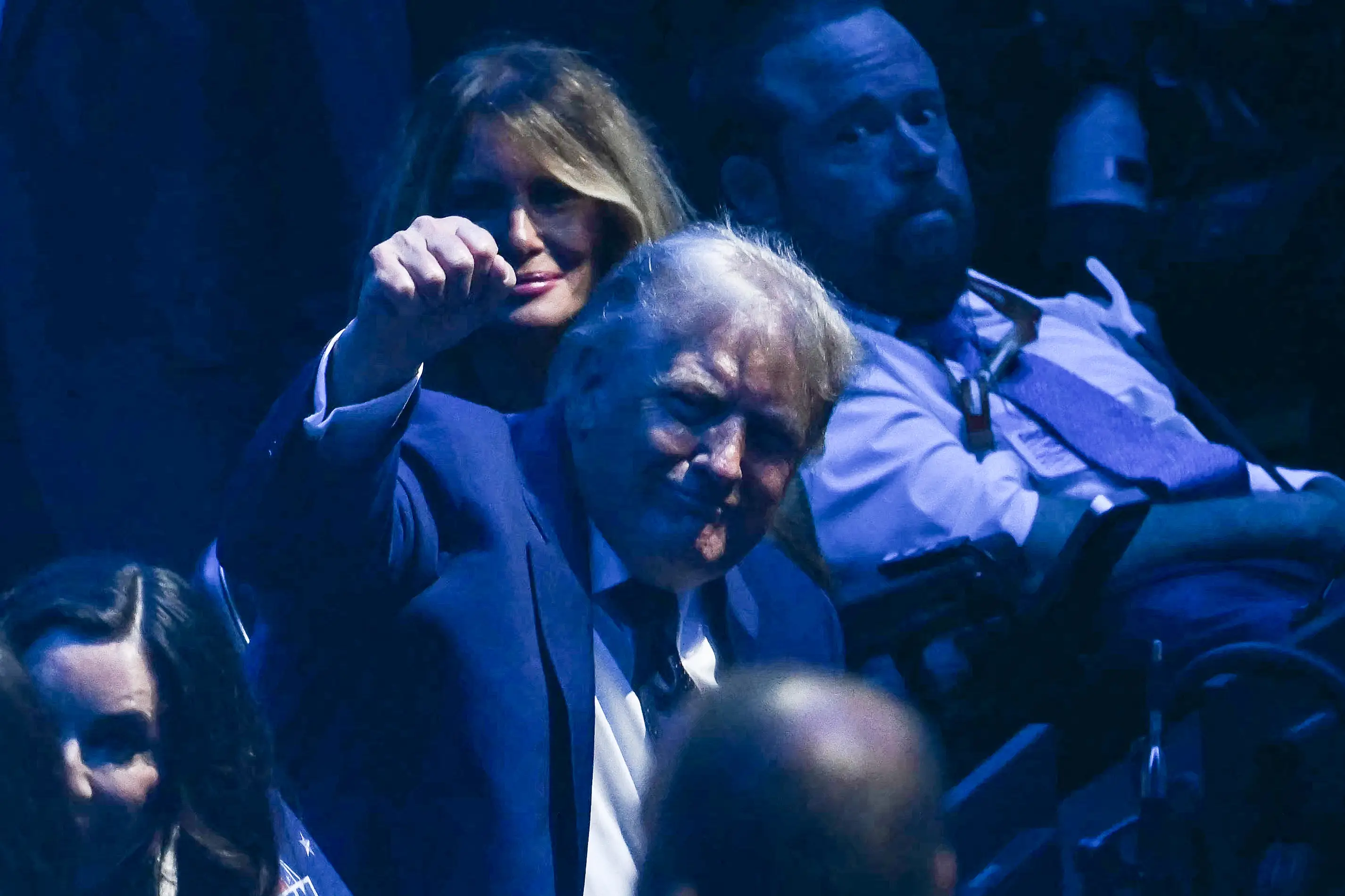 Donald Trump punches the air while watching the UFC fight unfold (Kent NISHIMURA / AFP via Getty Images)