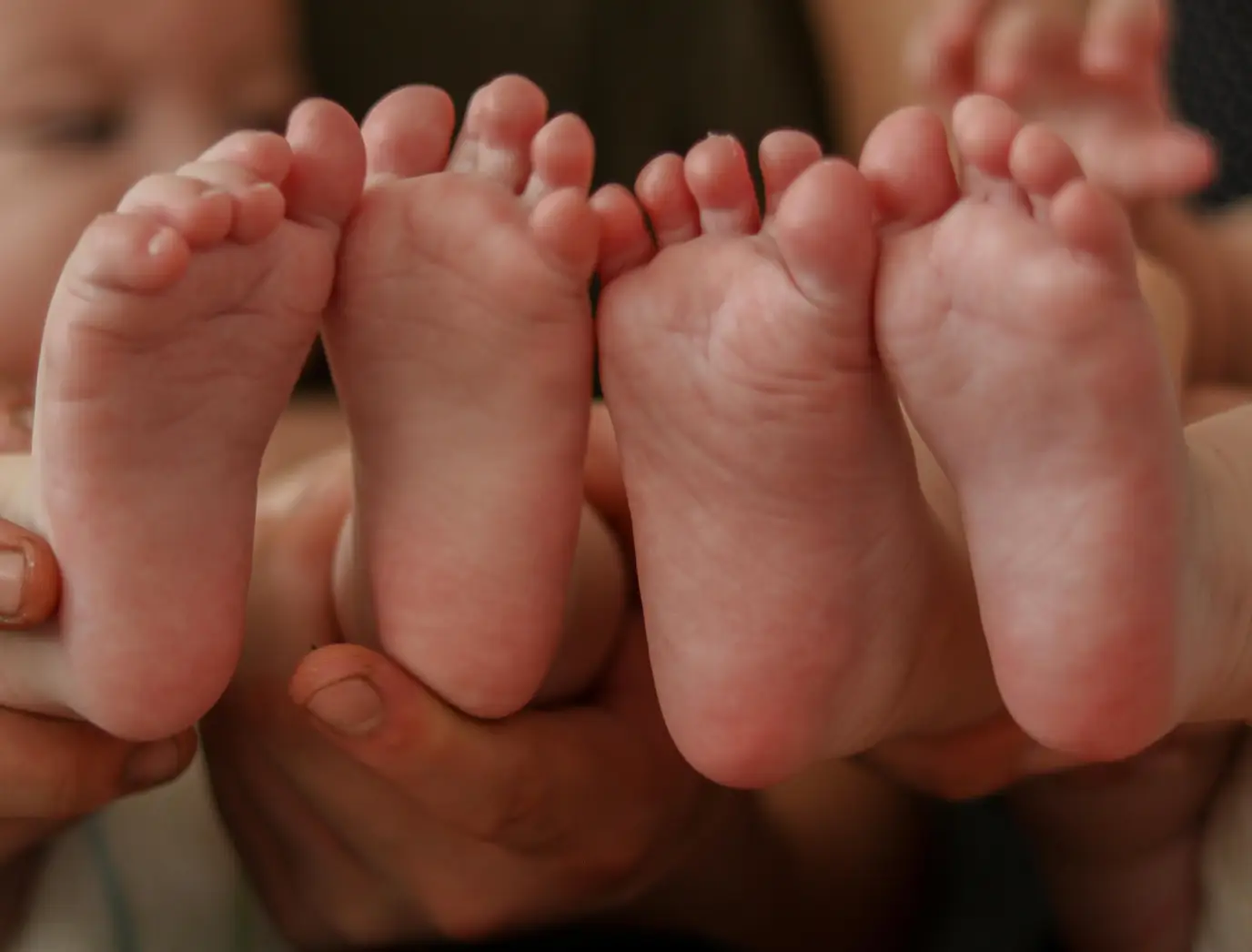 The twin in the US had a whole family back in South Korea.