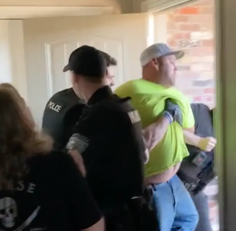 Police hauled Sherland out of the home.